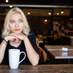 2:49 p.m. Alexis Berdahl watches the street and sidewalk traffic from a window seat at Atomic Coffee (W. Scott Olsen)